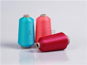 Colored elastic polyester